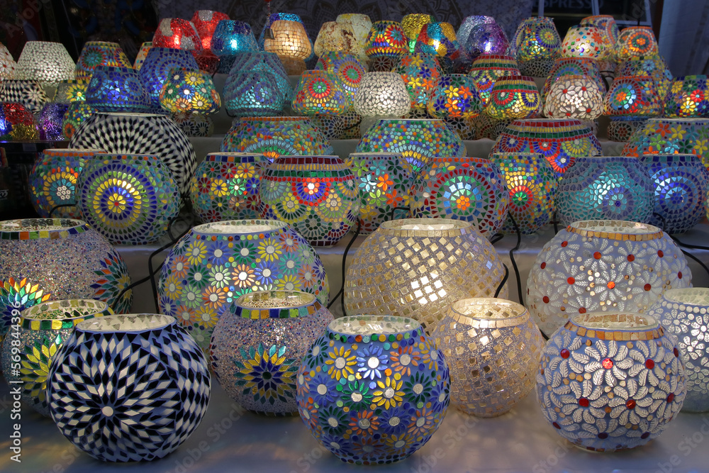 Table lamps decorated with mosaics of various colors for sale in a street market