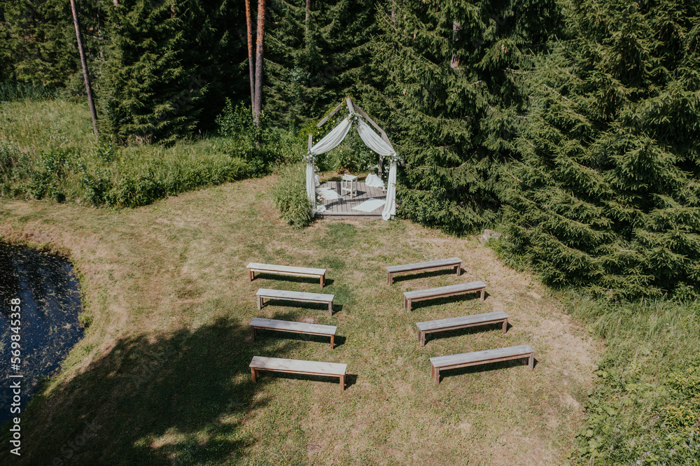 The location of wedding ceremonies is the gazebo in the wood, from above drone The location of wedding ceremonies is the gazebo in the wood, from above drone