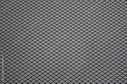 gray background, on the photo is a metal mesh chain-link