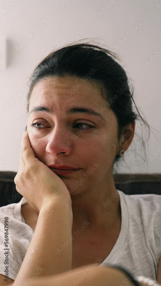 Depressed woman suffering from mental illness. Sad unhappy female person in emotional stress. Portrait of an adult girl crying in Vertical Video Depressed woman suffering from mental illness. Sad unhappy female person in emotional stress. Portrait of an adult girl crying in Vertical Video