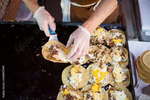 Hands Making Breakfast Tacos at the Farmers Market in Burlington photo