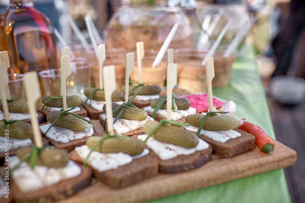 Sandwiches with cheese and pickles. Traditional Ukrainian snack. Catering concept