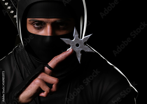 Close-up of a ninja holding a shuriken in the dark. Traditional ninja style. 3d illustration.