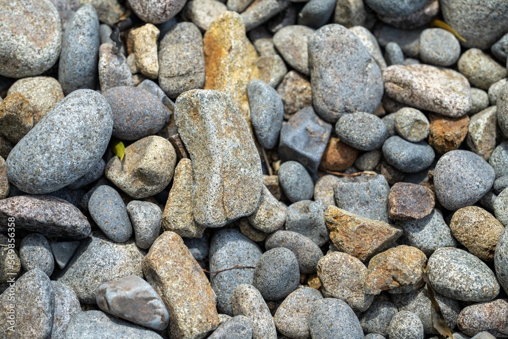 round rocks and pebbles on the beach in australia