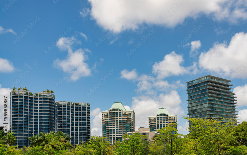 Image showcasing Condominiums with modern glass exterior at Miami, Florida. There are ...