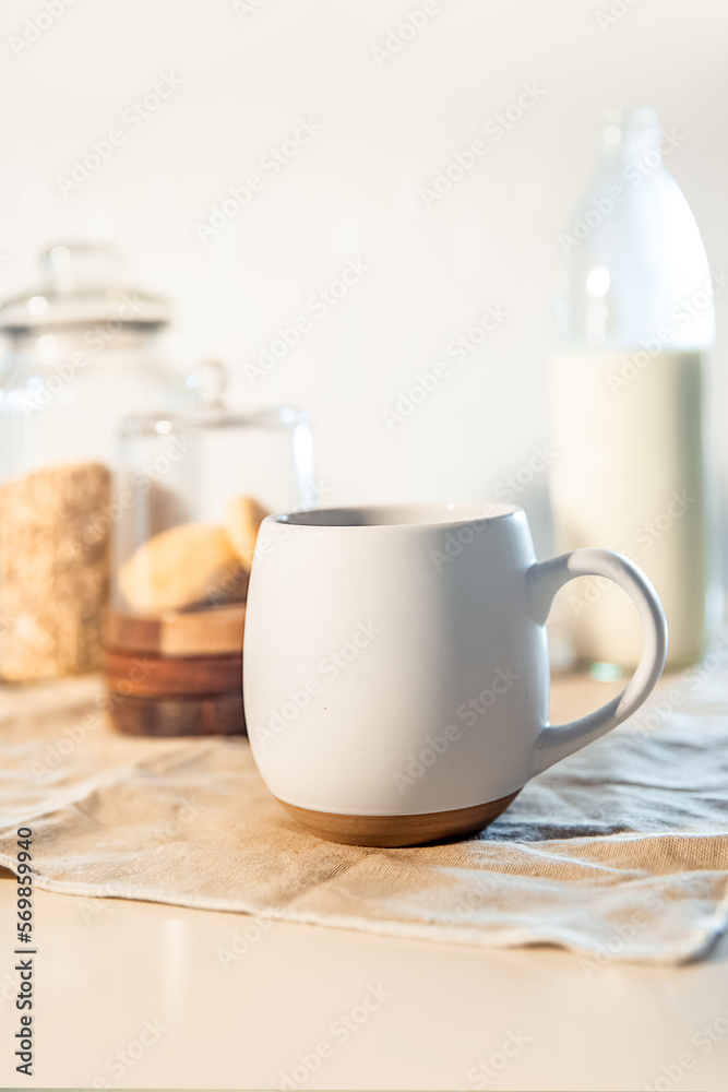 Obraz premium cookies and morning drink (coffee, milk or tea) in light natural envoronment, kinfolk style breakfast. High quality photo