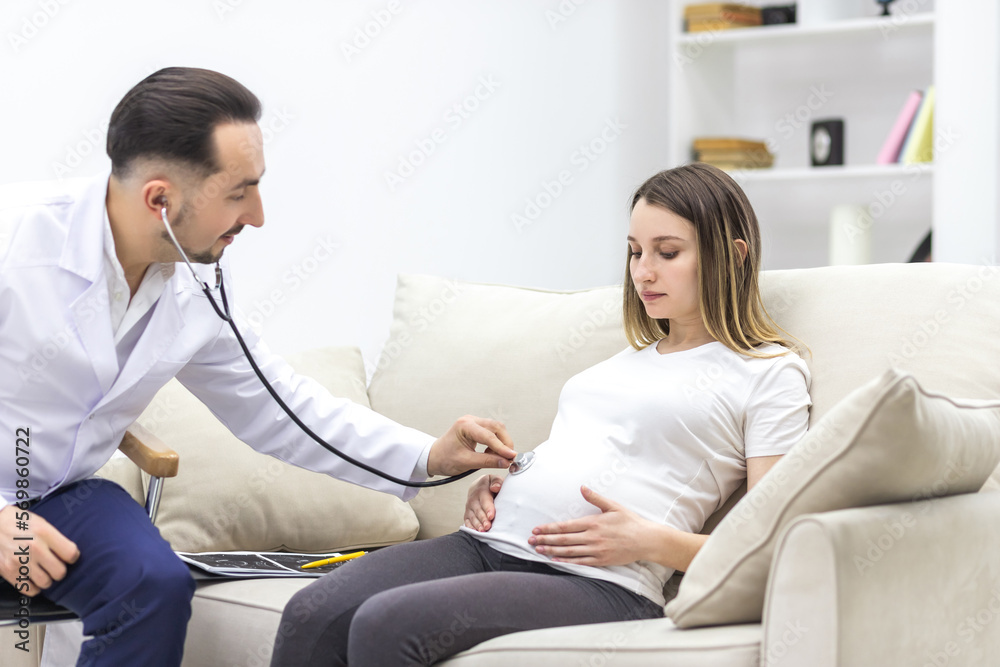Cropped photo of doctor with stethoscope going to exam the pregnant woman. Cropped photo of doctor with stethoscope going to exam the pregnant woman.