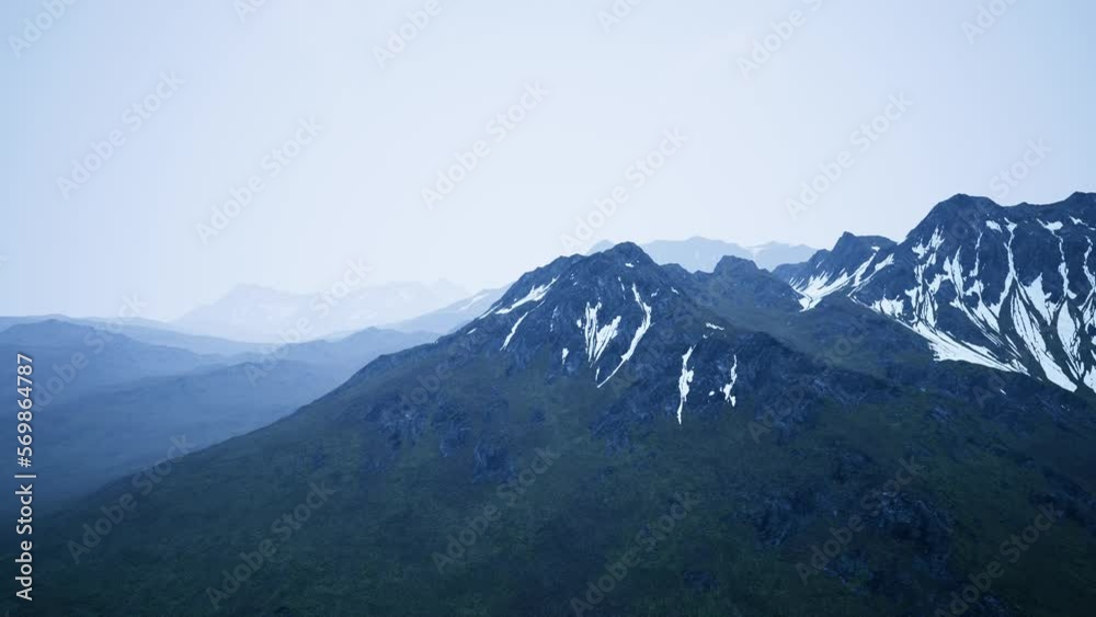 Awesome top view through clouds to high snowy mountains Awesome top view through clouds to high snowy mountains