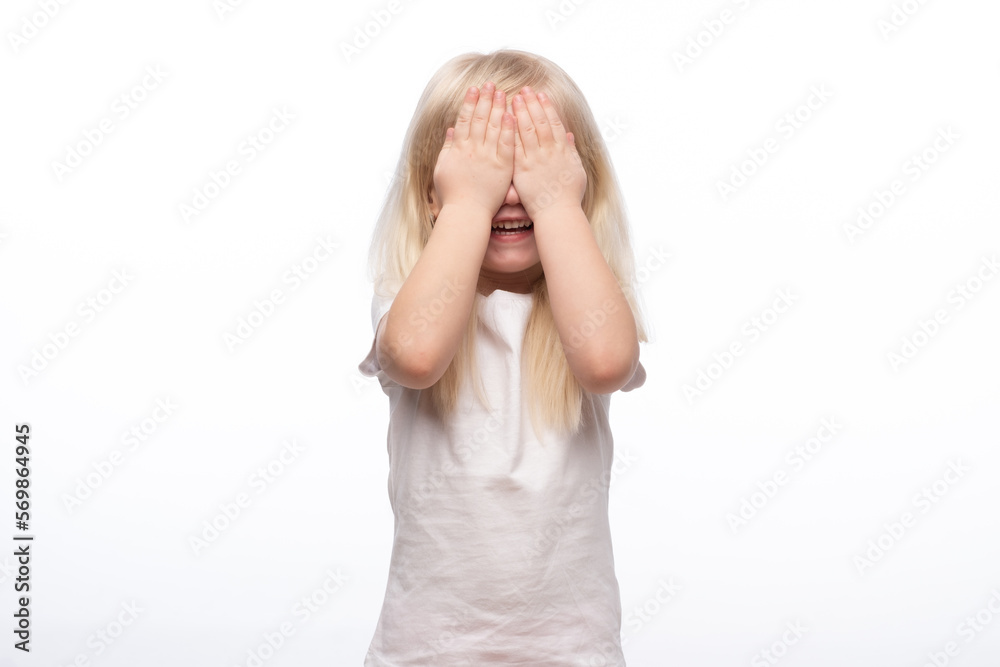 Little scared or crying or playing bo-peep girl hiding face. Isolated on white. Little scared or crying or playing bo-peep girl hiding face. Isolated on white.