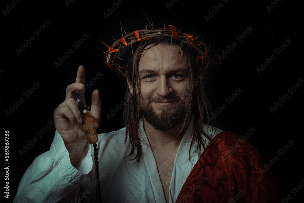 Jesus Christ with cross crucifix wearing a crown of thorns and white ...