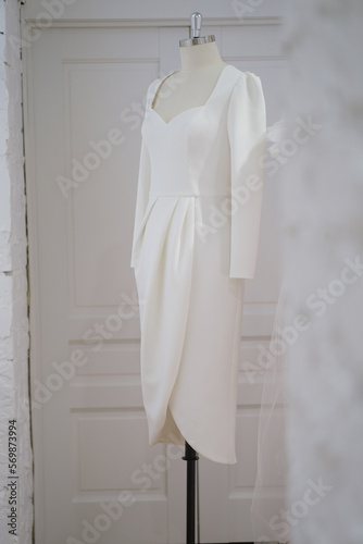 Elegant dress in the wedding salon. The choice of wedding dresses in the store