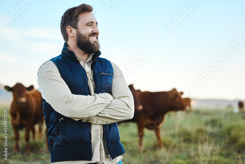 Smile, cow and agriculture with man on farm for sustainability, production or thinking industry growth. Agro, arms crossed or management of farmer on countryside field for dairy, animals for nature
