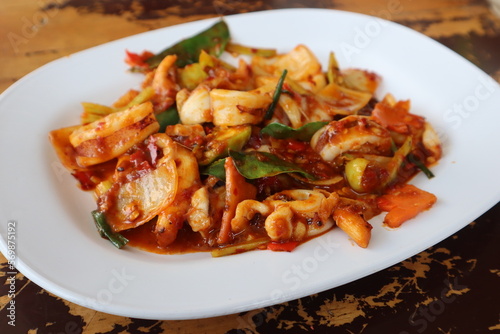 Authentic Thai Seafood Recipes, Stir Fried Squid with Roasted Chili Paste. Yummy and Exotic Thai Street Food You Should Try. 