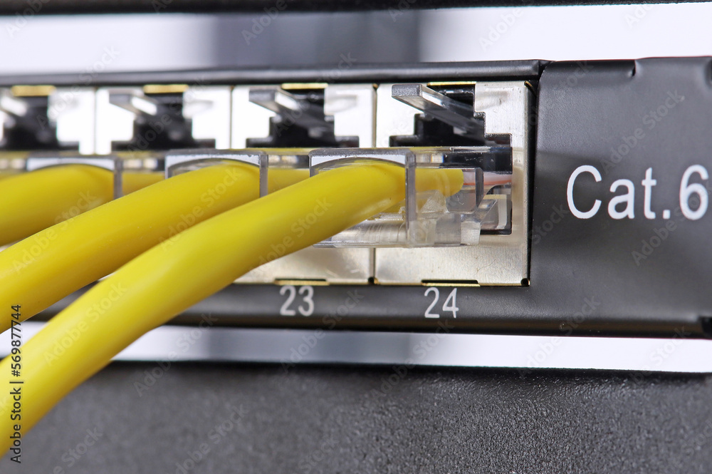 Connecting an Ethernet switch using patch cords with RJ45 connectors for data transmission in the data center.