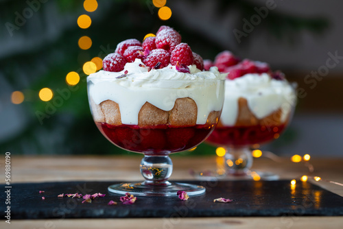 Konstfotografi Raspberry trifle with fruit jelly, custard and cream