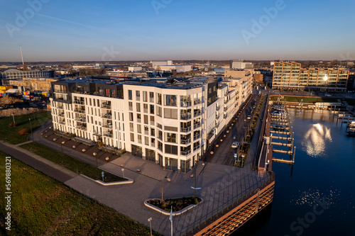 Exterior facade of Noorderhaven neighbourhood real estate at riverbed of the IJssel in Zutphen, The Netherlands, under construction. Aerial view of building plot. Housing and urban management. photo
