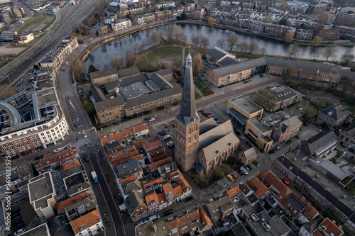 Urban development of historic city center and defense moat surrounding Hanseatic Zutphen with St. Janskerk church tower rising above