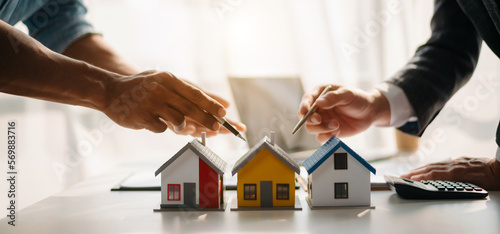 Wallpaper Mural Salesman Hands On House Model , Small Toy House Small Mortgage Property insurance and concepts real estate. Torontodigital.ca