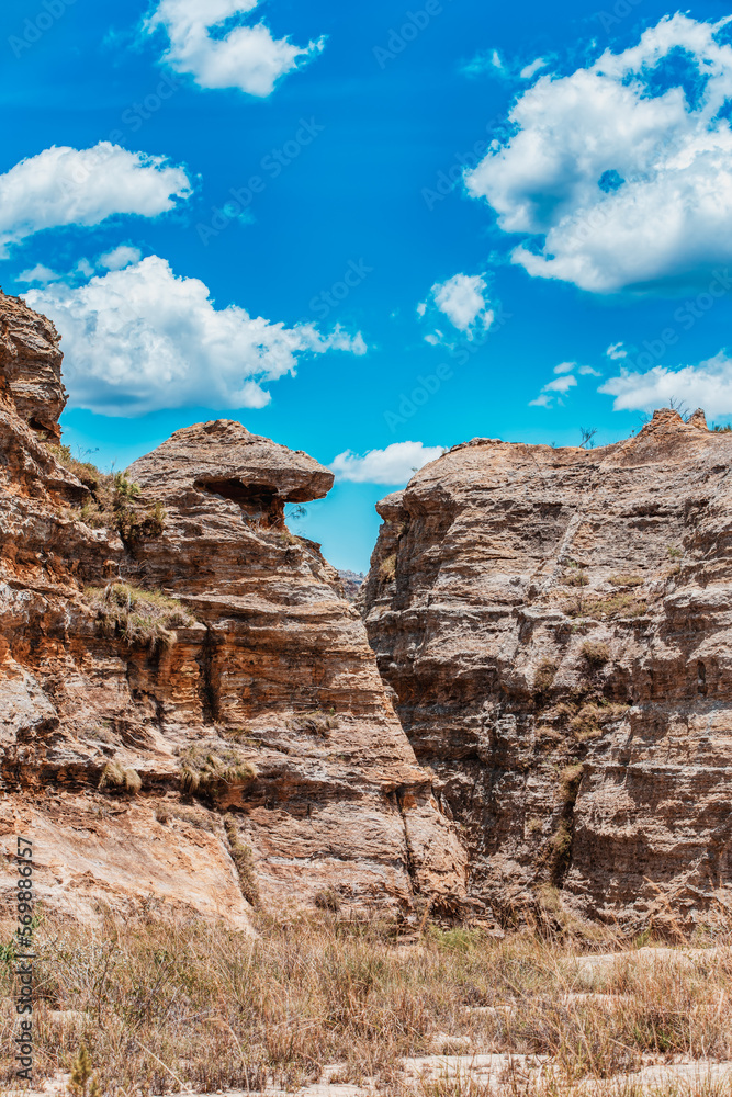 Fototapeta premium Isalo National Park in Ihorombe Region. Wilderness landscape with water erosion into rocky outcrops, plateaus, extensive plains and deep canyons like in Utah. Beautiful Madagascar panorama landscape.
