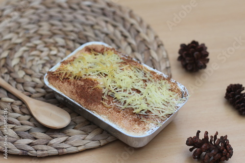 a close up of klapertart which is a typical food from Manado, Indonesian. Made from young coconut meat, sugar, flour, almonds, milk, butter, eggs, cinnamon and grated cheese. Indonesian food. photo