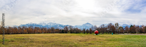 Park in autumn and mountains in the background. Almaty