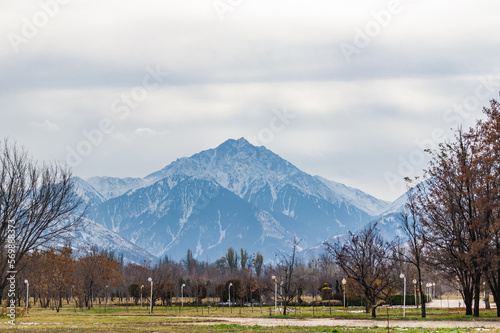 Park in autumn and mountains in the background. Almaty