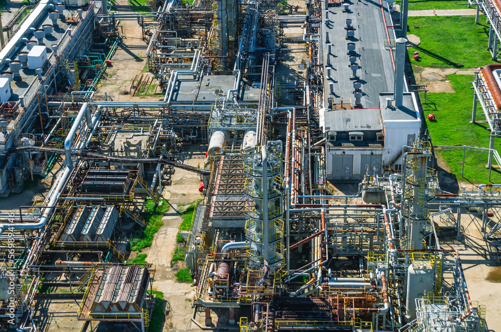 Panorama of the oil refinery. Production equipment at a petrochemical plant. Oil refining production. Oil refining and gasoline production. Technological network of production communications.