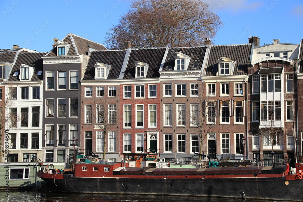 Amsterdam Amstel River House Facades with Houseboat, Netherlands