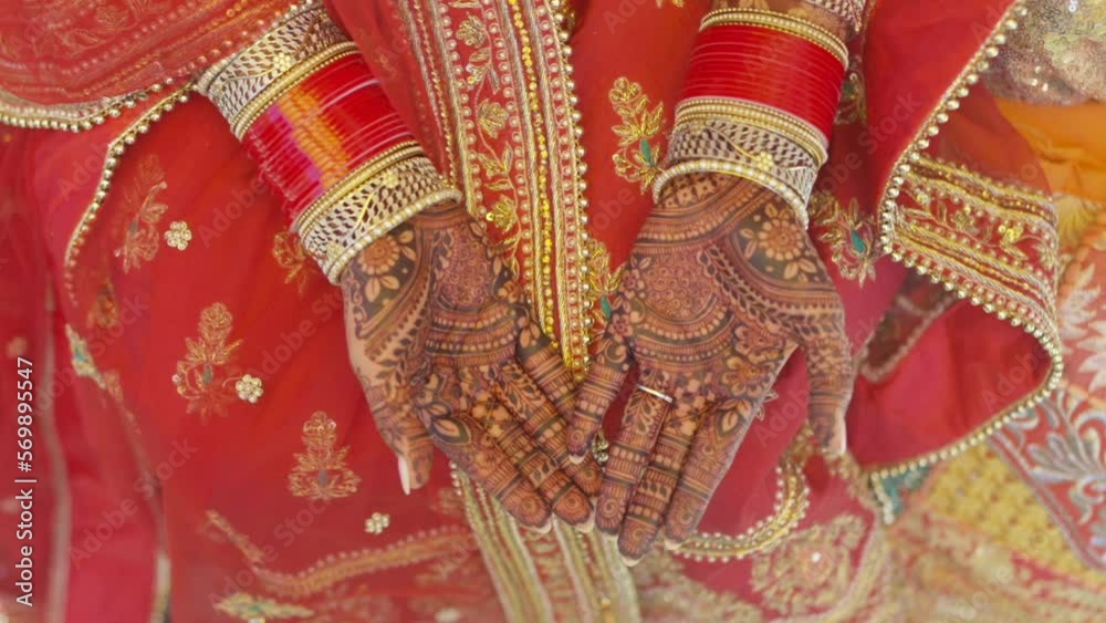 Mehndi design for hands. Close-up of adult woman hands with wrinkles covered mehndi pattern Mehndi design for hands. Close-up of adult woman hands with wrinkles covered mehndi pattern