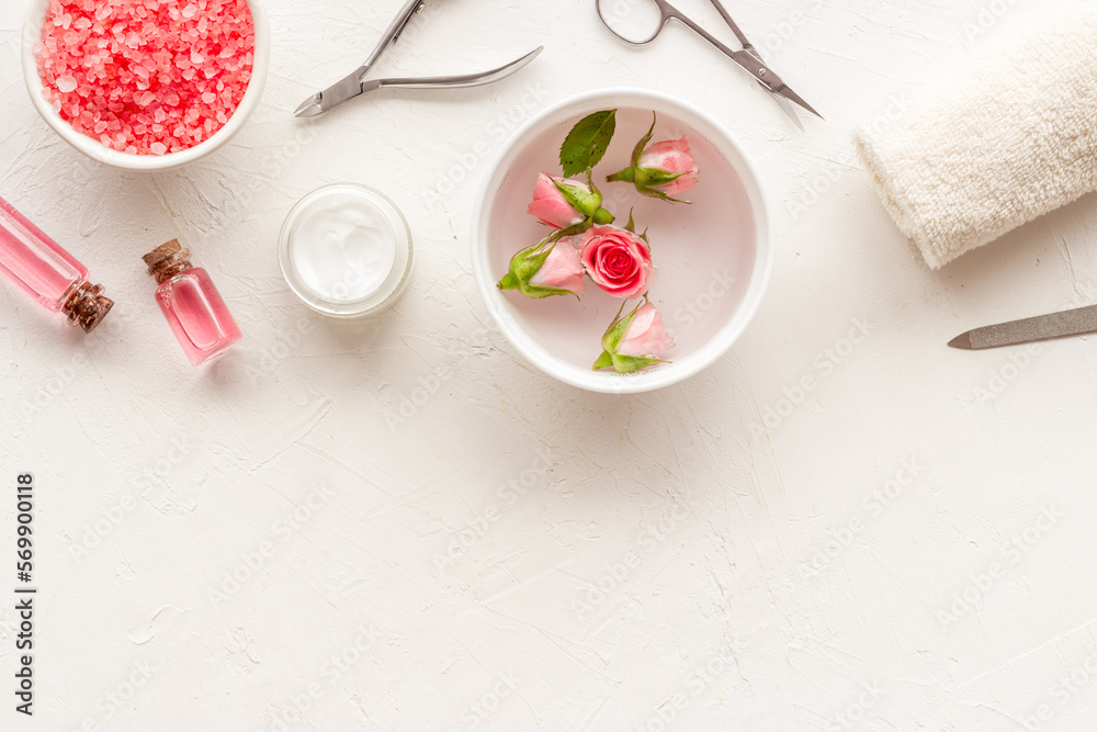 Manicure accessories with pink roses flowers. Beauty care salon spa.