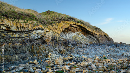 Sea Cliff at Cocklawburn Beach, located in north Northumberland, Saltpan Rocks consist of limestone, sandstone, shales and thin coals deposited 330 M years ago in carboniferous times photo