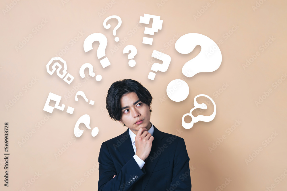 疑問を持つ若いビジネスマン Stock Photo | Adobe Stock