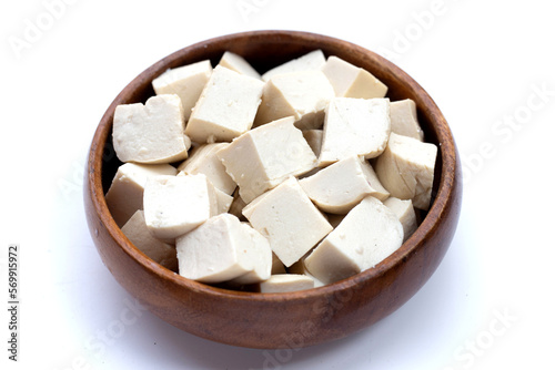 White tofu in wooden bowl on white background