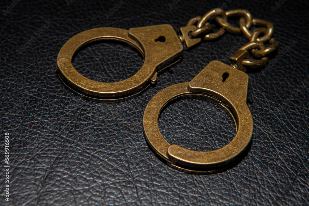 image of handcuffs leather background image of handcuffs leather background