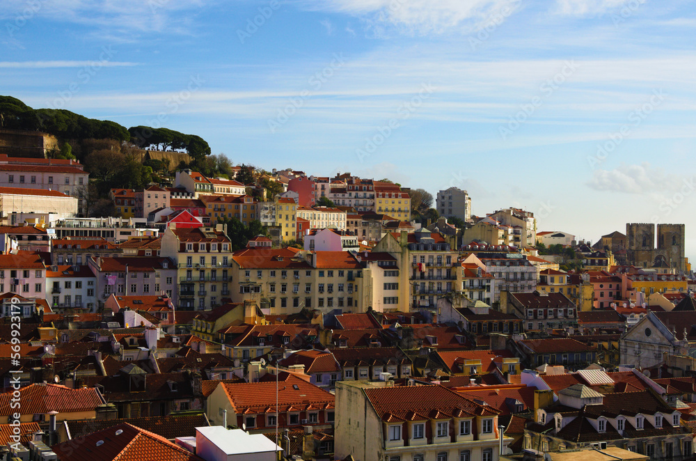 Panoramic landscape view of city center of Lisbon. View from top of Santa Justa Lift. Vintage buildings with red tile roofs. Travel and tourism concept. Sunny day