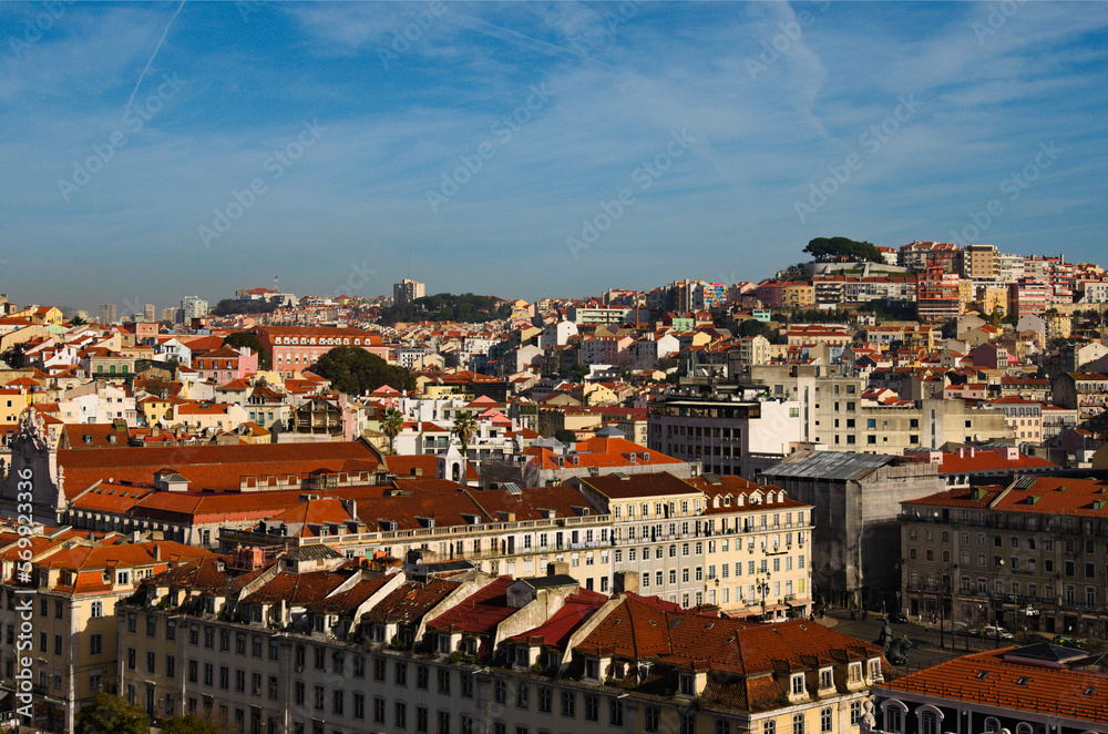 Awesome aerial landscape view of city center of Lisbon. View from top of Santa Justa Lift. Vintage buildings with red tile roofs. Travel and tourism concept. Sunny day