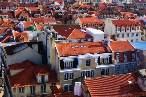 Detailed landscape view of ancient red tile roof buildings in city center of Lisbon. View from top of Santa Justa Lift. Sunny day