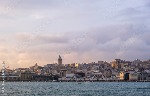 sunset view in istanbul bosphorus. Red sunset in Istanbul. Historical Galata tower and istanbul silhouette. View of the Galata Tower in Beyoglu district at sunset along the Golden Horn in Istanbul.