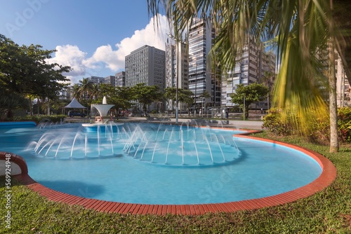 City of Santos, Brasil. Frog Fountain, beach gardens and waterfront buildings. Long exposition photography. 