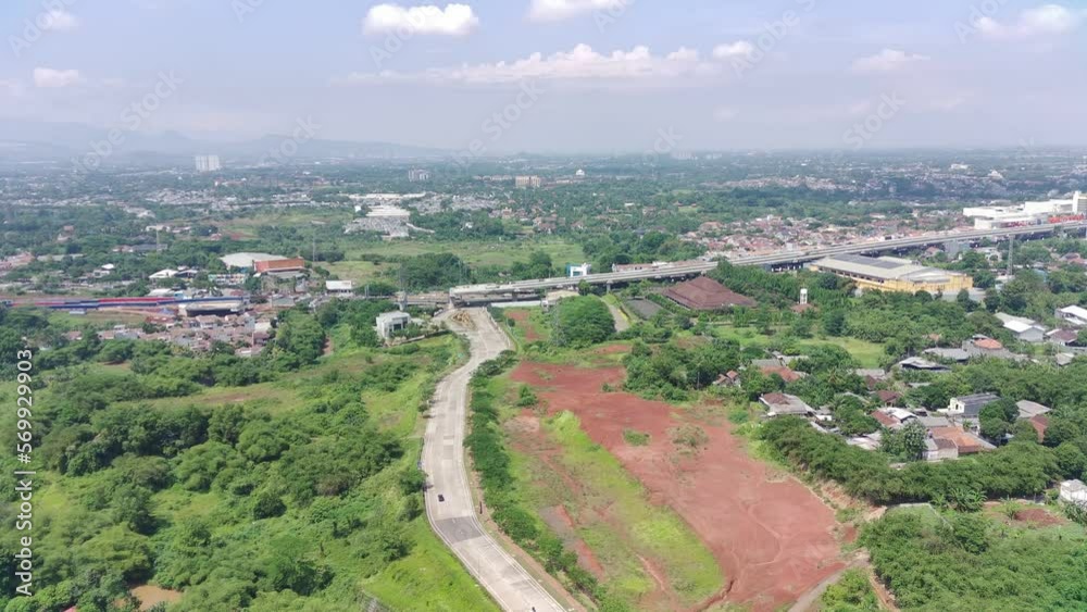 aerial view of the highway between greenery and residential areas. aerial view of the highway between greenery and residential areas.