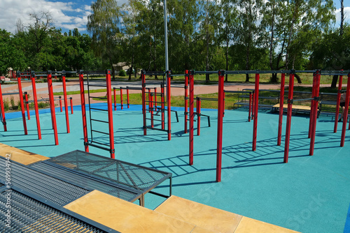 Sports ground with horizontal bars and other new exercise equipment © Harmony Video Pro
