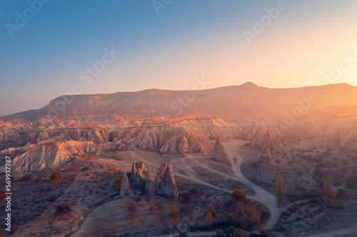 Beautiful sunrise landscape in Cappadocia with colorful hot air balloon deep canyons, valleys. Concept banner travel Turkey © Parilov