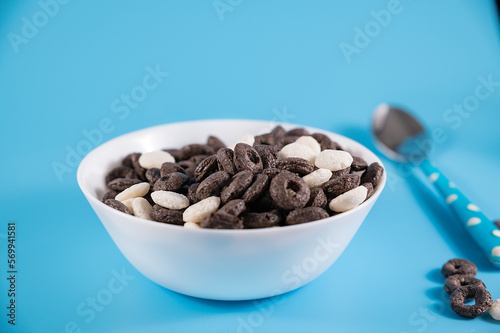 Oreo Flavored Breakfast Cereal, black and white dry breakfast rings. Cup with delicious breakfast and milk. High quality FullHD footage