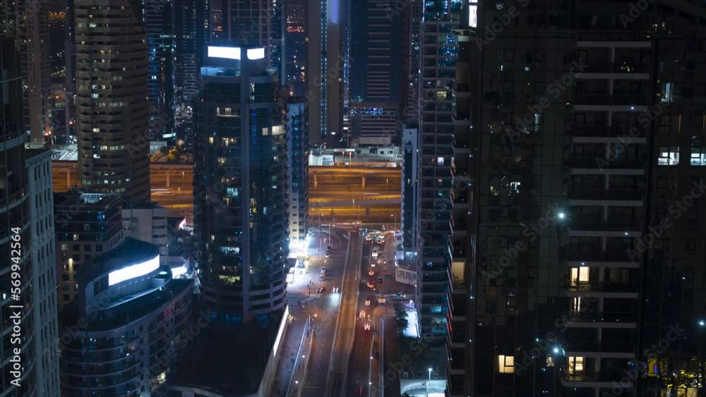 Timelapse, 4k, aerial view of the urban landscape of a modern night city, people move along the street, cars move along the road Timelapse, 4k, aerial view of the urban landscape of a modern night city, people move along the street, cars move along the road