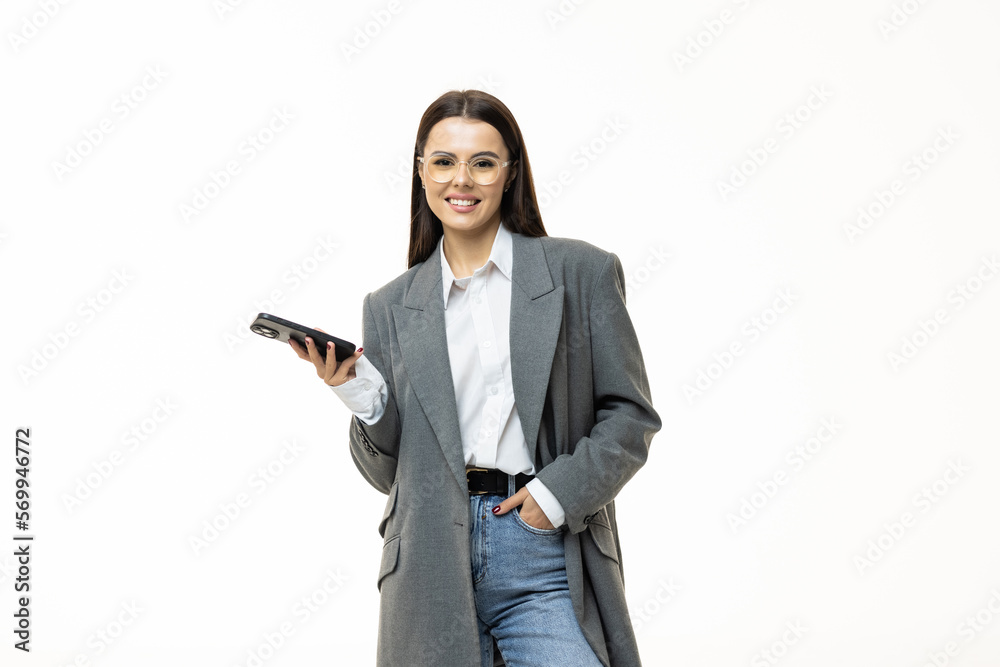 Portrait of a happy a businesswoman holding mobile phone and looking away isolated over white background Portrait of a happy a businesswoman holding mobile phone and looking away isolated over white background
