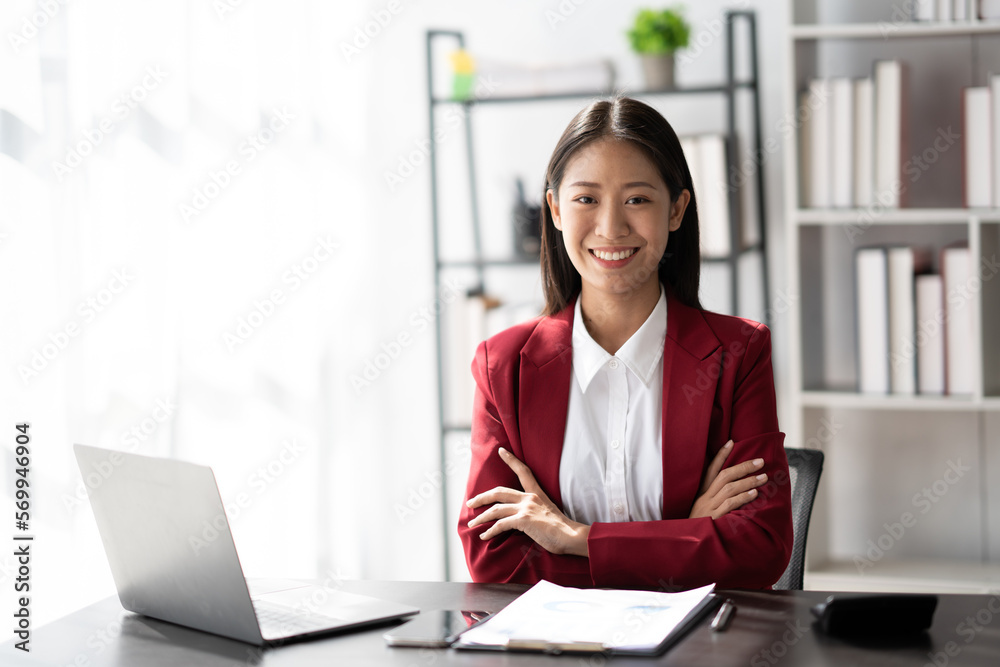 Portrait of Confident asian businesswoman sitting in the modern office room. Portrait of Confident asian businesswoman sitting in the modern office room.