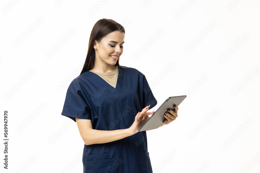 Photo of young woman doctor wear formal coat holding modern gadget empty space isolated white color background Photo of young woman doctor wear formal coat holding modern gadget empty space isolated white color background