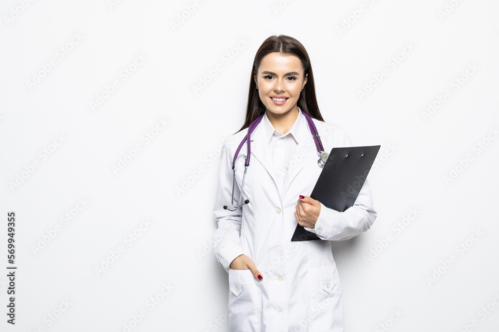 Young happy smiling female doctor in white coat with folder and stethoscope Young happy smiling female doctor in white coat with folder and stethoscope