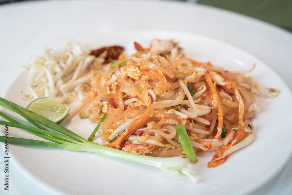 Pad Thai noodles with lemon and spring onion side dish served for lunch