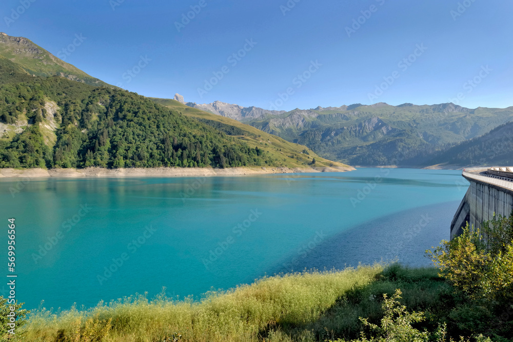 the roselend dam with turquoise water in a mountainous landscape in France